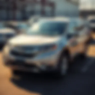A 2014 Honda CRV parked in an auction lot, showcasing its clean exterior and low mileage, ready for restoration.