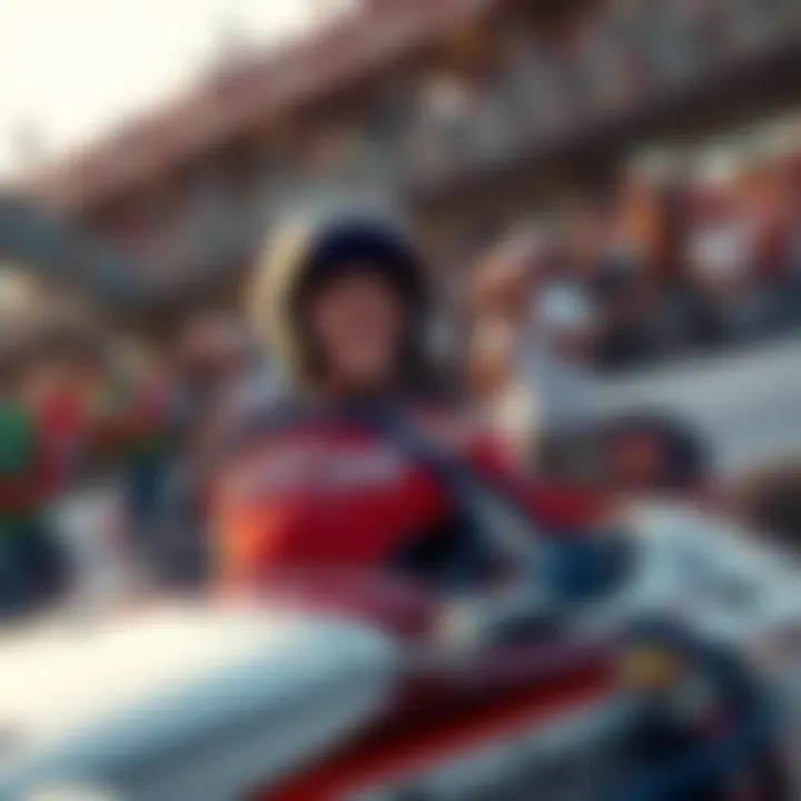 Josh Wise driving his race car with fans cheering in the background.