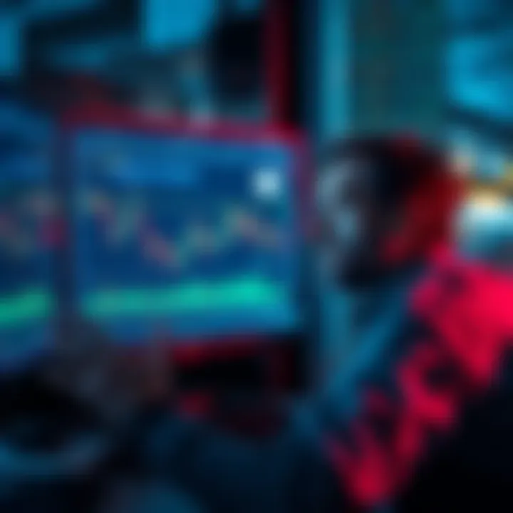 A worried investor looking at falling stock charts on a computer screen