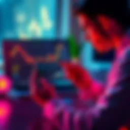 A person looking at a graph on a laptop while holding a smartphone showing cryptocurrency prices