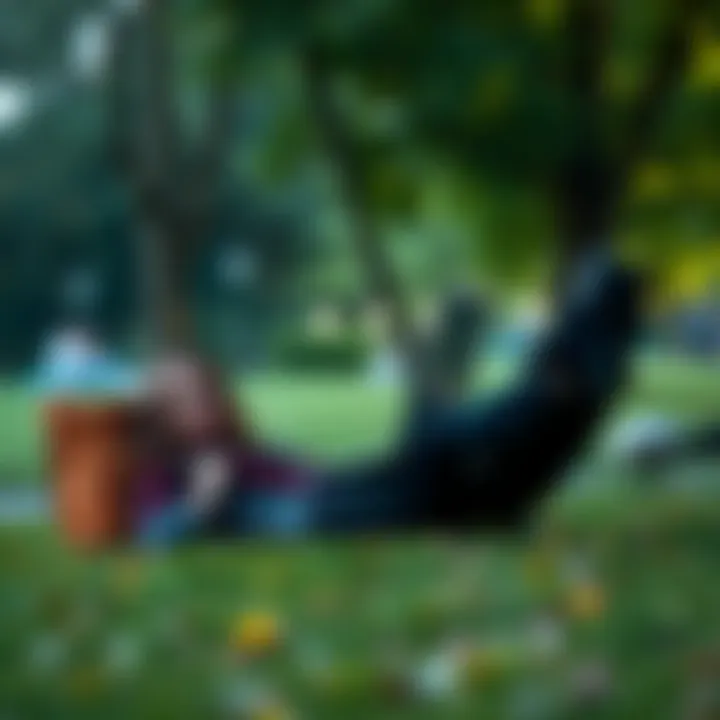 A person relaxing in a park with a laptop, symbolizing freedom and embracing life beyond work.
