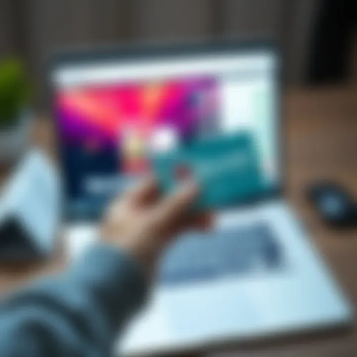 Person holding a Revolut card with a laptop showing a digital purchase screen in the background