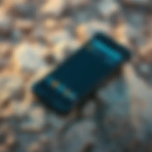 A rugged Android phone with a tough design and large battery displayed on a rocky surface outdoors, showcasing its durability and features.