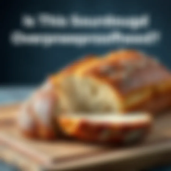 A dense sourdough loaf with a crispy crust, sliced to show its texture, placed on a wooden cutting board